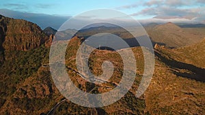 View from the height of the rocks and winding road in the Masca at sunset, Tenerife, Canary Islands, Spain.