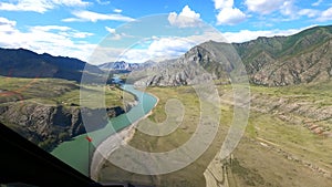 View from a helicopter flying over the turquoise Katun.