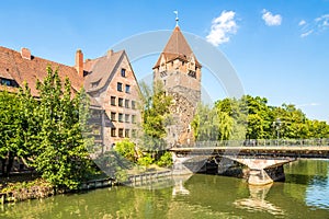 View at the Heubrucke bridge with Schuldturm Tower and Pegnitz river in Nuremberg ,Germany