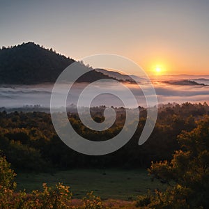 A view of the high hills at sunset on a foggy day.