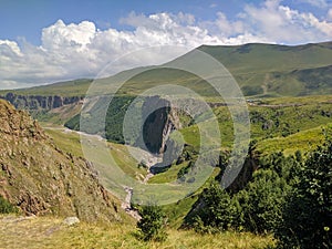 View of the high plateau, Caucasian mountains and green hills. Prielbrusye National Park, Kabardino-Balkaria, Caucasus, Russia