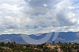 A view from the high point of a hiking trail in Palmer Park of the Rocky Mountains and Colorado Springs, Colorado