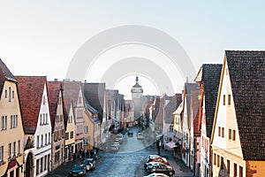 View from a high point to a beautiful street with traditional German houses in Rothenburg ob der Tauber in Germany