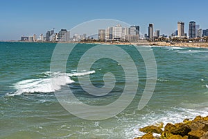 View from a high point of view; the azure blue sea with the Tel Aviv skyline, with its many modern buildings on the boulevard and