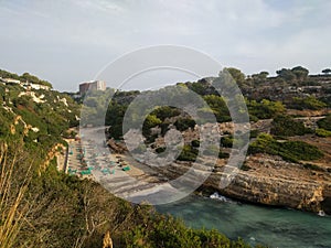 View from the high rocky shore to the sandy beach