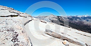 View of the High Sierras as seen from the top of Half Dome in Yosemite National Park in California USA