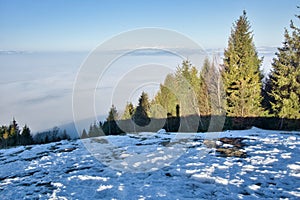 View of the High Tatras mountain ridge from Slubica peak with inversion mist