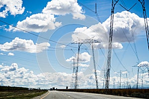 View of high voltage towers and lines while driving on I-5 interstates, south California