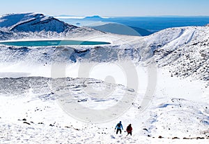 View of hikers at Emerald lakes on Tongariro Crossing track