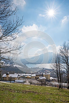 View from hiking path to Tegernsee lake and tourist hotel bavaria