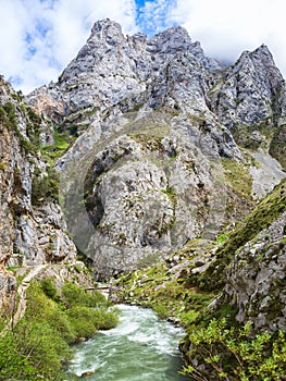 View from hiking trail Cares Trail or Ruta del Cares along river Cares in spring near Cain, Picos de Europa National Park, photo