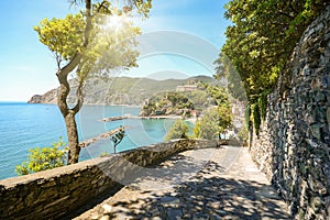 View from hiking trail to beautiful coastline and beach of mediterranean sea near village Monterosso al Mare in early summer,