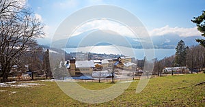 View from hiking trail to lake tegernsee and mountain hotel