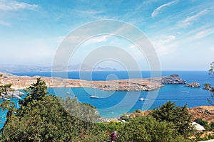 View from the hill of the Acropolis on the Mediterranean coast in the city of Lindos, Rhodes island, Greece