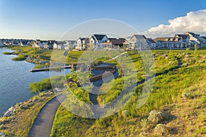 View from a hill with grass of Daybreak residences at South Jordan, Utah