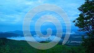 Vegetation and greenery on the hill KriÃÂ¾evac in Medjugorje and a view of the lowlands and the mountain range. photo