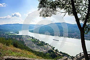 A view from the hill of Visegrad castle to Danube river and a ship, villages and mountains