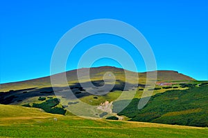 View of the hills patronising the fields below