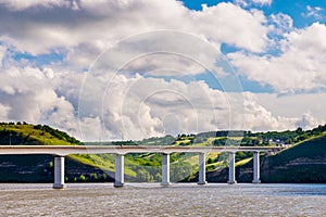 View of hills and steppe and a modern bridge over upper river Don in Russia