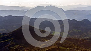 View of the hills at sunset in the evening fog of the Republic of San Marino