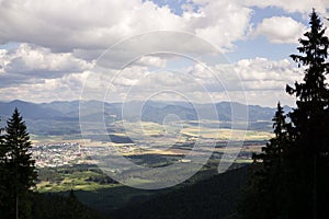 View from the hills to the city and nature during sunny day.