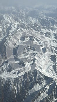 View of the Hindu Kush mountains in the Himalayas in India from an Airplane