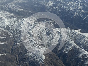 View of the Hindu Kush mountains in the Himalayas in India from an Airplane