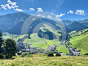 View of Hinterglemm village and mountains in Saalbach-Hinterglemm skiing region in Austria on a beautiful summer day