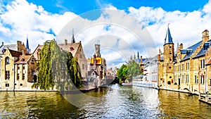 View of the historic buildings and the Belfort Tower from the Dijver canal in the city of Bruges, Belgium