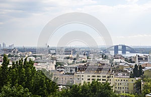 View of historic district Podil by the Dnipro river, and Podolsky bridge. Kyiv, Ukraine