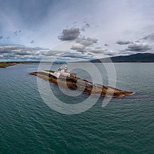 View of the historic Fenit Lighthouse on Little Samphire Island in Tralee Bay