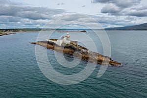 View of the historic Fenit Lighthouse on Little Samphire Island in Tralee Bay