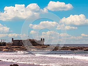 view of a historic fort from matosinhos beach, portugal