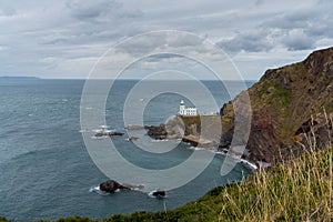 View of the historic Hartland Point lighthouse and headland on Bristol Bay
