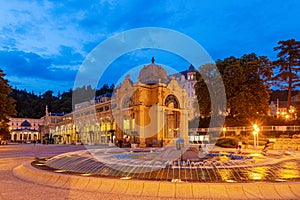 View on historic Kolonada building and singing fountain in the Czech spa town Marienbad in evening twillight in summer