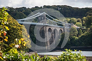 A view of the historic Menai suspension bridge spanning the Mena