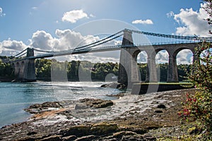 A view of the historic Menai suspension bridge spanning the Mena