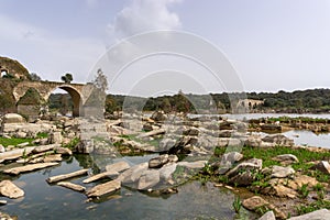 View of the historic Ponte de Ajuda bridge over the Guadiana River photo