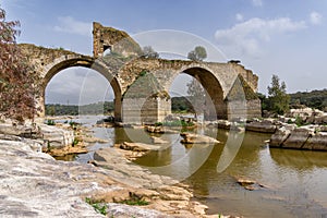 View of the historic Ponte de Ajuda bridge over the Guadiana River photo