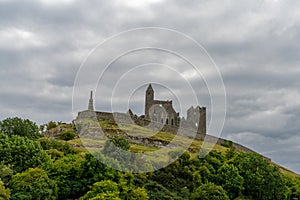 View of the historic Rock of Cashel in County Tipperary of Ireland under an overcast and stormy sky