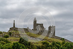 View of the historic Rock of Cashel in County Tipperary of Ireland under an overcast and stormy sky