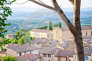 View of the historic town of San Gimignano with Tuscan countryside on a sunny day in summer, Tuscany, Italy