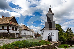 View of the historic village center and old church in Holloko photo