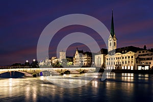 View of historic Zurich city center with famous Fraumunster Church and river Limmat at Lake Zurich , in twilight, Canton