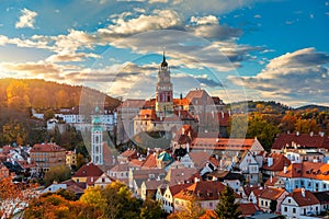 View of historical centre of Cesky Krumlov town on Vltava riverbank on autumn day overlooking medieval Castle, Czech Republic. photo