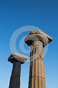 View of historical ruins with clear, blue sky background captured in the temple of Athena at the ancient city of Assos