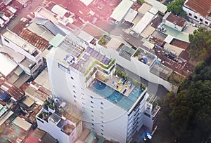 View of Ho Chi Minh city, Vietnam from the top. Swimming pool is on the roof of a building.