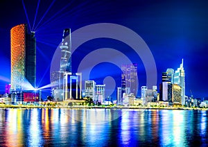 Hochiminh city at night from the bank of Saigon river, Vietnam. photo