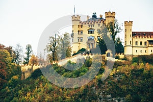 View of Hohenschwangau Castle on hill in in autumn season. The famous tourist attraction in the Bavaria. Germany.