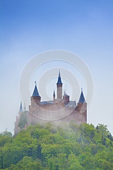 View of Hohenzollern castle in haze during summer